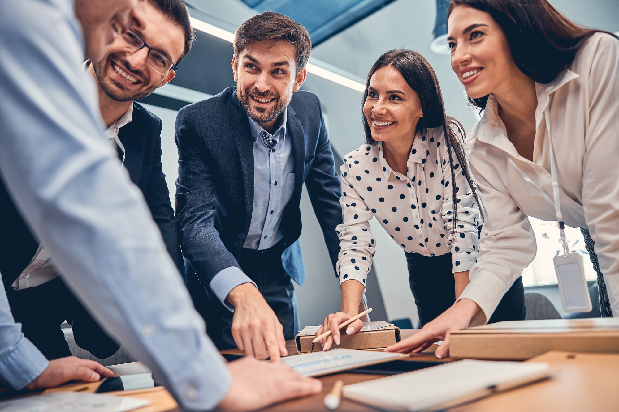Professional group of manager collaborating on creative budget report Professional group of manager collaborating on creative budget report